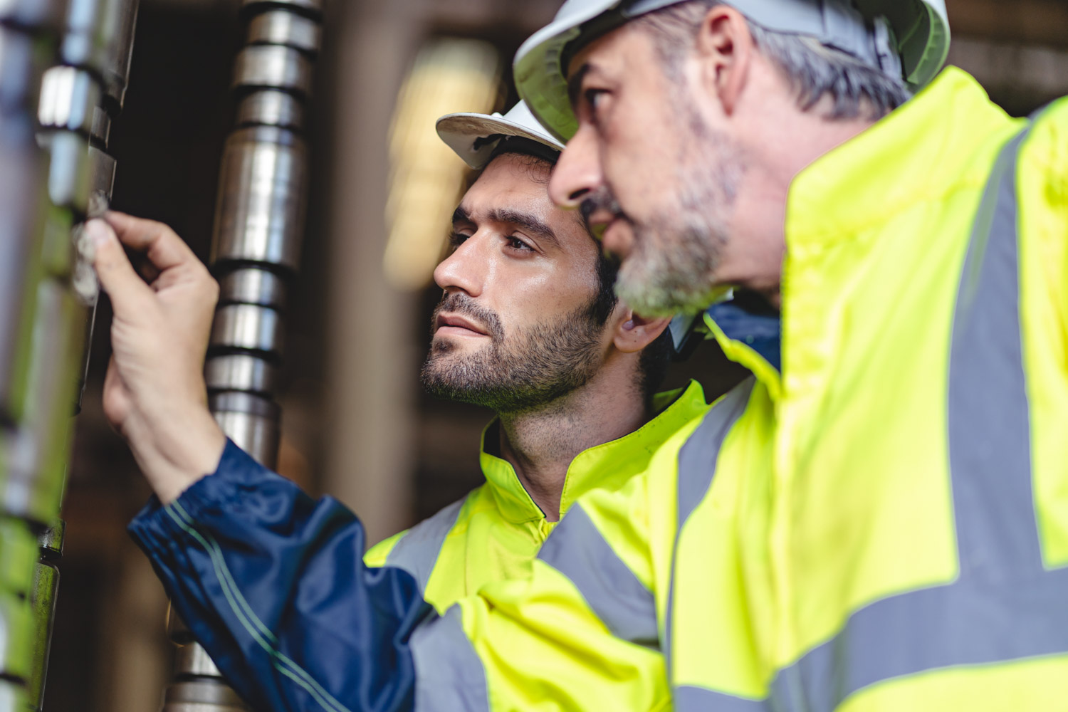 professional technician engineer with safety hard hat working to maintenance construction