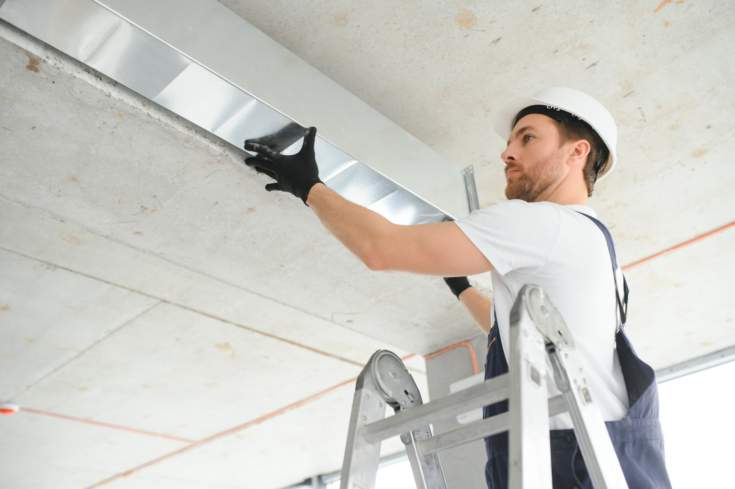 hvac services worker install ducted pipe system for ventilatio